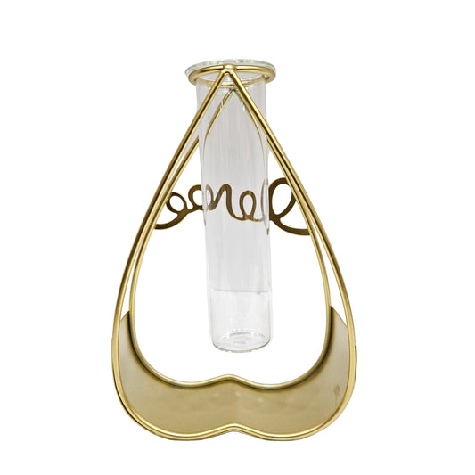Gold heart-shaped metal frame stand features a clear glass tube for propagation