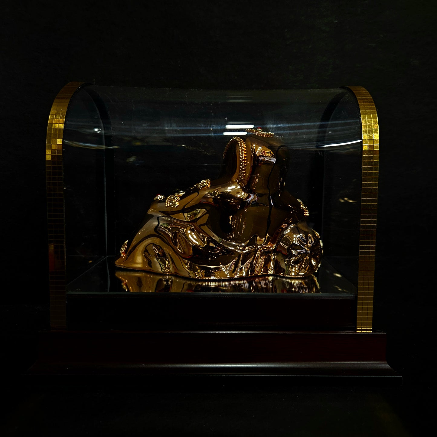 24 carat gold Plated resting position vinayaka idol with stone designer,transparent protective cabin