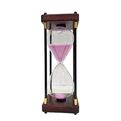 Decorative 48min hourglass featuring a baby pink sand timer housed in a light wood and black metal frame