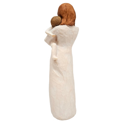 Willow Tree figurine, titled "Child of My Heart" and sculpted by Susan Lordi, parent holding a baby close to their chest