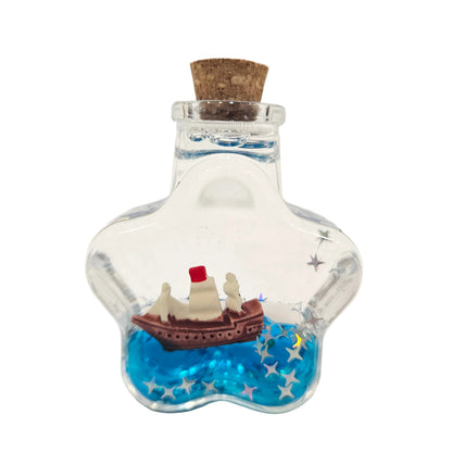 Decorative star-shaped glass wishing bottle containing a miniature ship and blue liquid Showpiece Figurine
