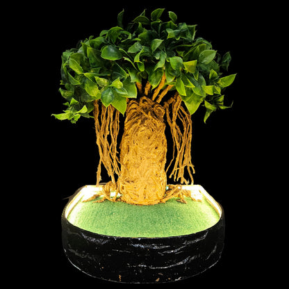 Decorative sculpture of a tree, possibly inspired by a banyan or baobab, featuring an intricate trunk and hanging aerial roots.