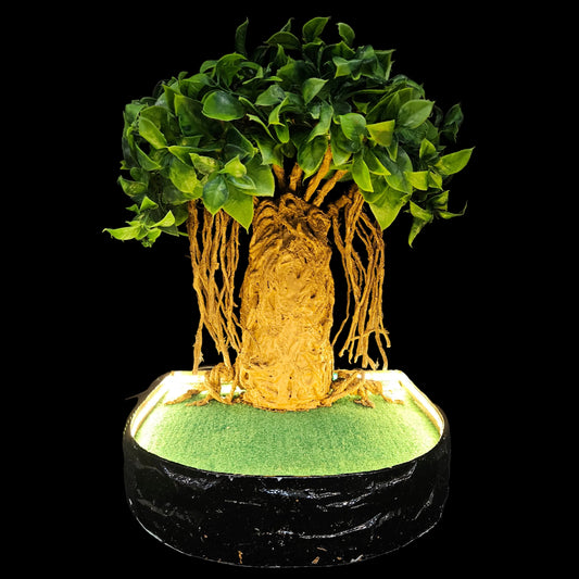 Decorative sculpture of a tree, possibly inspired by a banyan or baobab, featuring an intricate trunk and hanging aerial roots.