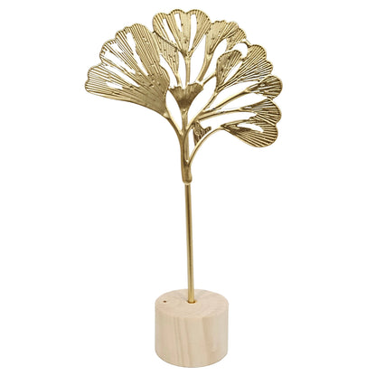 Golden ginkgo leaf decorative showpiece featuring a textured metal leaf on a stand with a round wooden base