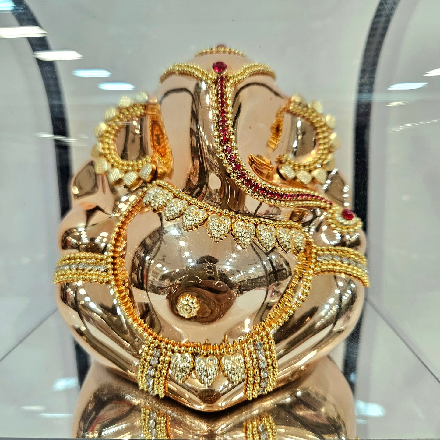 Lord vinayaka murti 24carats gold Plated idol Statue in a transparent protective cabin