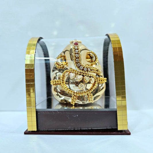 Lord vinayaka murti in a attractive look Decorated with stones designed in a transparent protective cabin